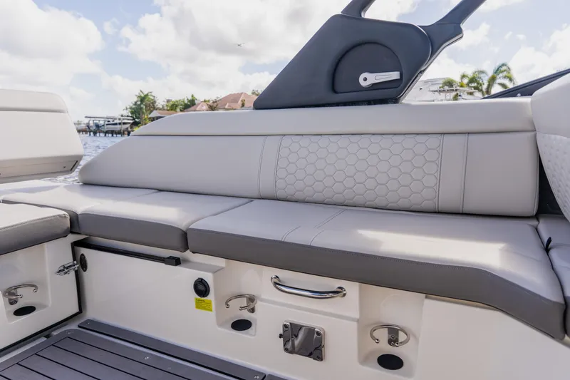Slide: The Image of 2021 Sea Ray SDX 250 Outboard boat interior with cushioned seating and modern design. - 63