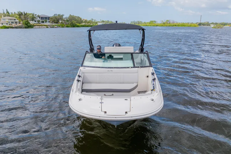 Slide: The Image of 2021 Sea Ray SDX 250 Outboard boat cruising on a scenic lake. - 7