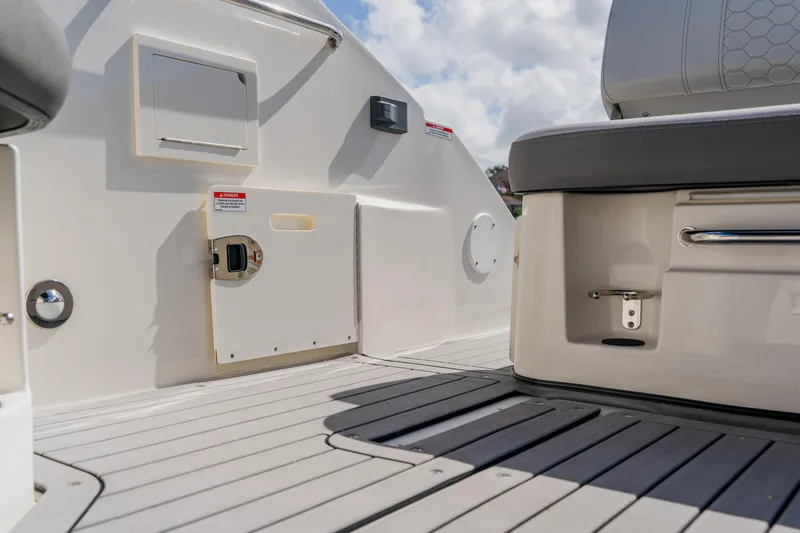 Slide: The Image of 2021 Sea Ray SDX 250 Outboard boat interior with seating and storage compartments. - 71