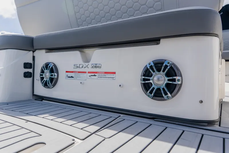Slide: The Image of 2021 Sea Ray SDX 250 Outboard boat speakers and seating detail. - 76
