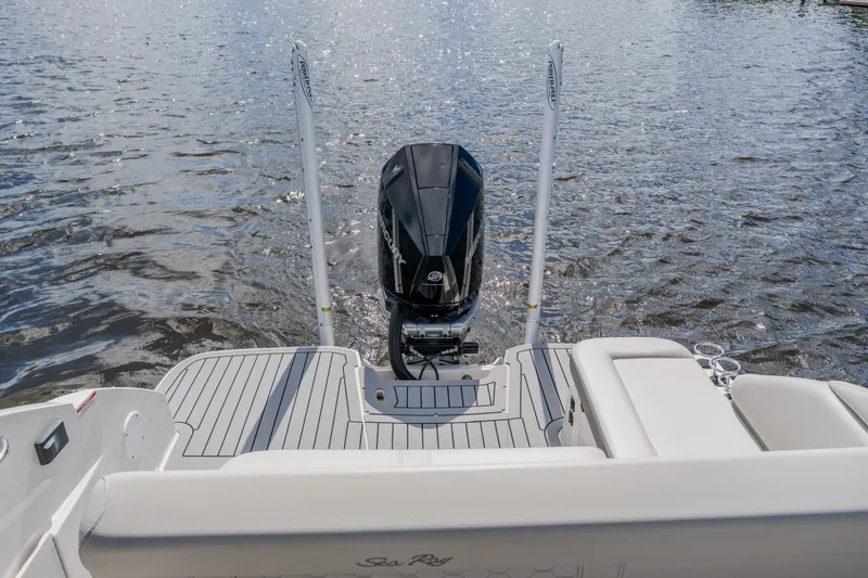 Slide: The Image of 2021 Sea Ray SDX 250 Outboard boat on water, rear view with motor. - 79