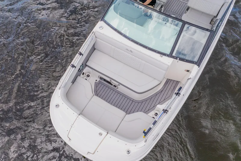 Slide: The Image of 2021 Sea Ray SDX 250 Outboard boat on water, featuring spacious seating and sleek design. - 8