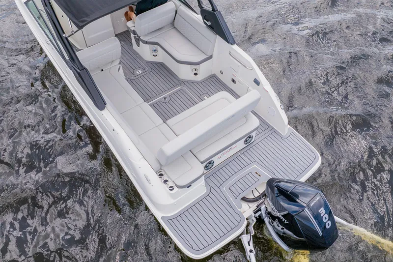 Slide: The Image of 2021 Sea Ray SDX 250 Outboard boat with spacious seating on water. - 9