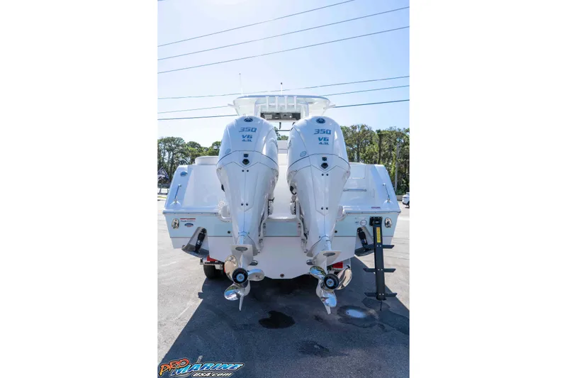 Slide: The Image of 2026 Sea Hunt Ultra 305 Coffin Box with twin 350 V6 engines, rear view. - 10