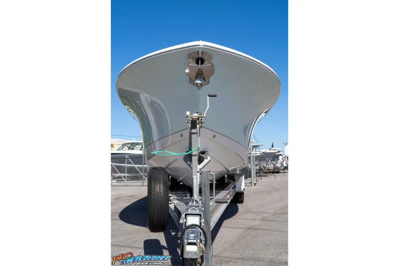 Slide: The Image of 2026 Sea Hunt Ultra 305 Coffin Box boat on trailer, viewed from front. - 15