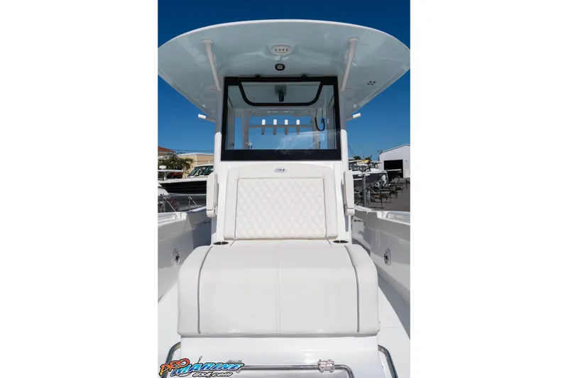 Slide: The Image of 2026 Sea Hunt Ultra 305 Coffin Box boat, featuring sleek white seating and modern design. - 18