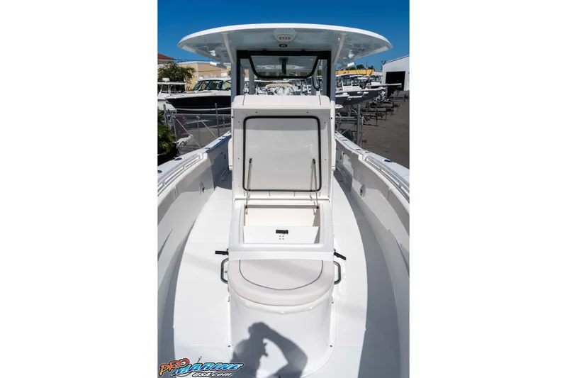 Slide: The Image of 2026 Sea Hunt Ultra 305 Coffin Box boat interior with open storage compartment. - 20