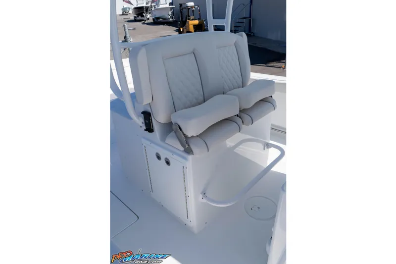 Slide: The Image of Luxury seating on 2026 Sea Hunt Ultra 305 Coffin Box boat, featuring cushioned armrests. - 24
