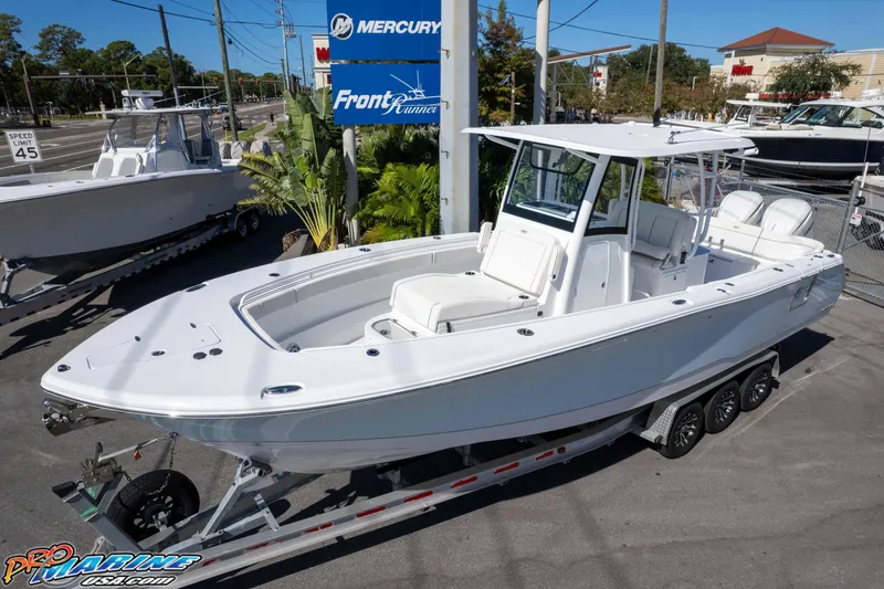 Slide: The Image of 2026 Sea Hunt Ultra 305 Coffin Box boat on trailer at dealership. - 3