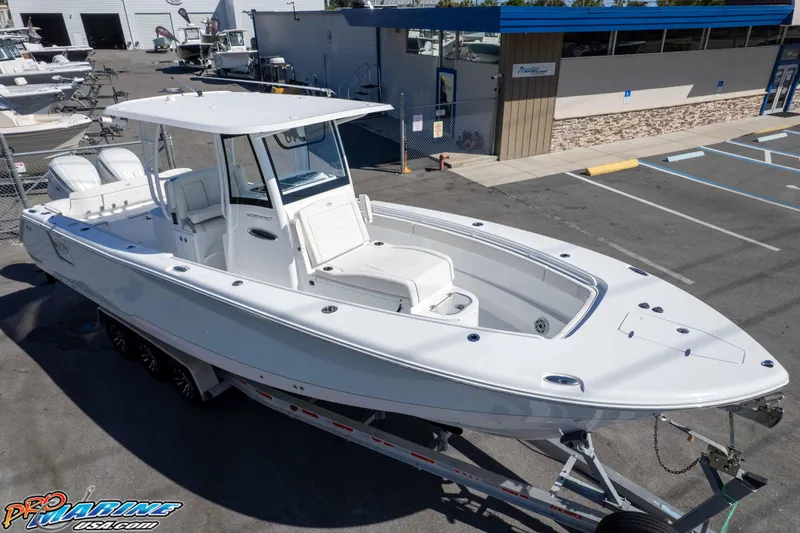 Slide: The Image of 2026 Sea Hunt Ultra 305 Coffin Box boat on trailer at dealership. - 6