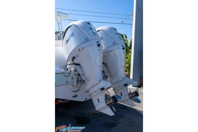 Slide: The Image of Twin Yamaha outboard engines on a 2026 Sea Hunt Ultra 305 Coffin Box boat. - 8