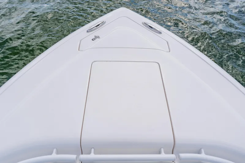 Slide: The Image of Bow of a 2018 Intrepid 327 Center Console boat on water. - 29
