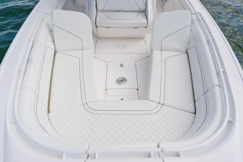 Slide: The Image of 2018 Intrepid 327 Center Console boat with white cushioned seating. - 37