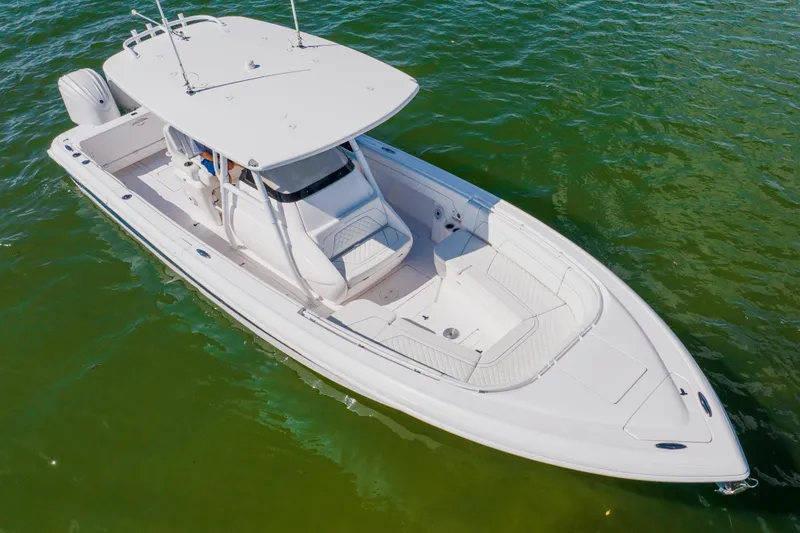Slide: The Image of 2018 Intrepid 327 Center Console boat on green water, aerial view. - 5