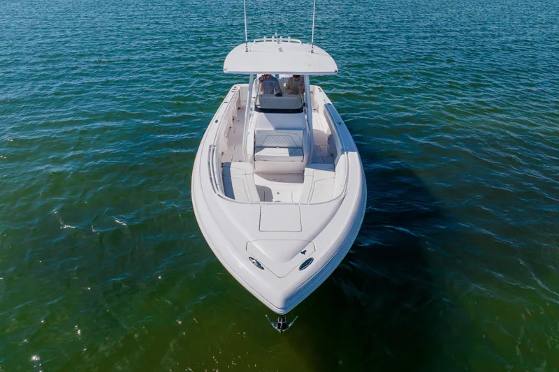 Slide: The Image of 2018 Intrepid 327 Center Console boat on calm water, aerial view. - 6