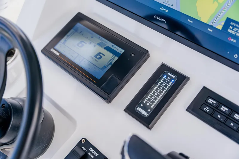 Slide: The Image of Control panel of a 2018 Intrepid 327 Center Console boat with Garmin display. - 67