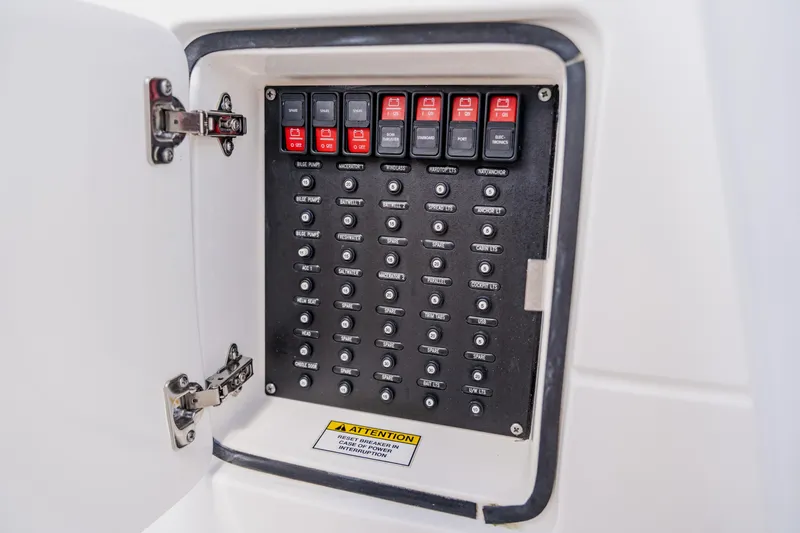 Slide: The Image of Electrical panel on a 2018 Intrepid 327 Center Console boat, featuring labeled switches. - 71