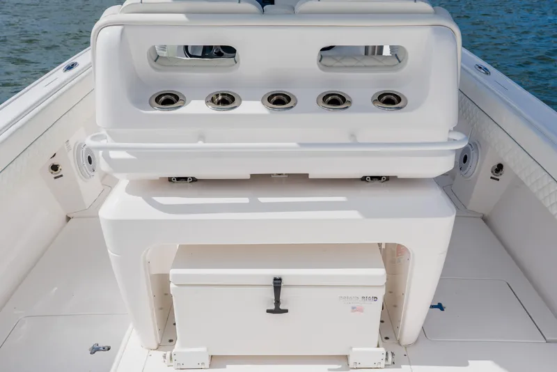 Slide: The Image of 2018 Intrepid 327 Center Console boat interior with seating and storage features. - 75
