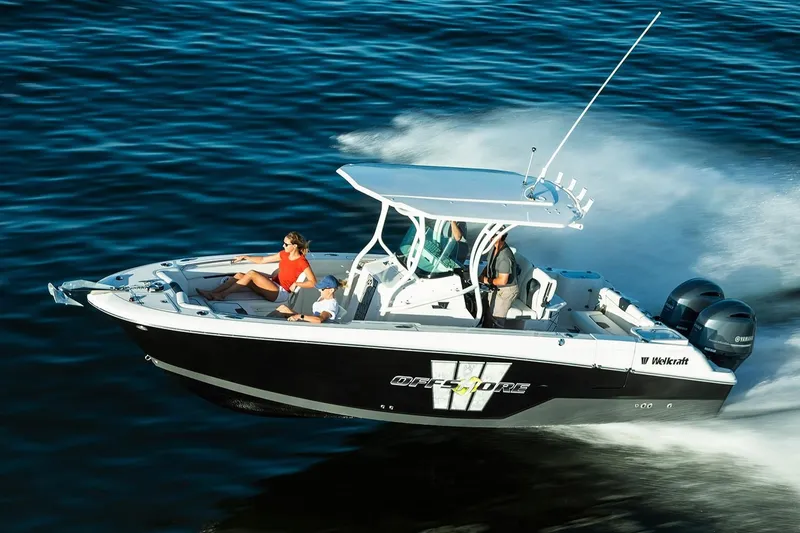 Slide: The Image of 2019 Wellcraft 262 Fisherman boat cruising on open water. - 56