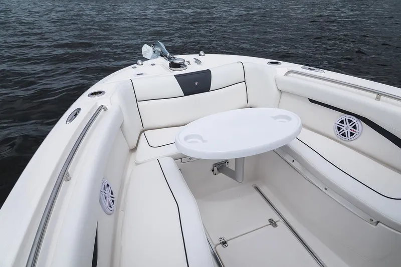 Slide: The Image of 2019 Wellcraft 262 Fisherman boat interior with white seating and table. - 58
