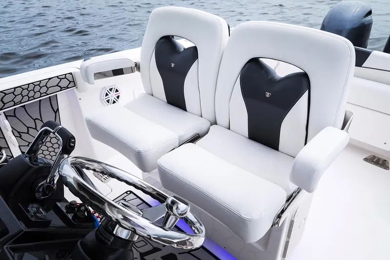 Slide: The Image of 2019 Wellcraft 262 Fisherman boat seats and steering wheel. - 62