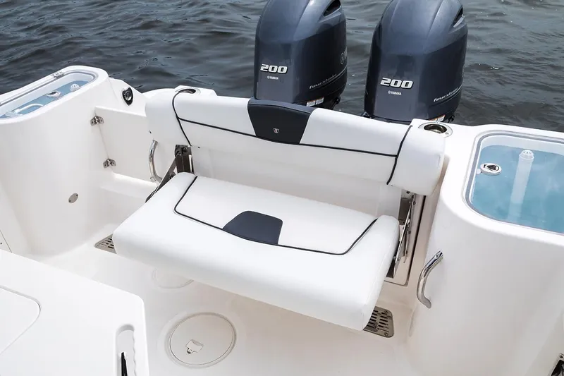 Slide: The Image of 2019 Wellcraft 262 Fisherman boat with twin Yamaha 200 engines and foldable seating. - 63