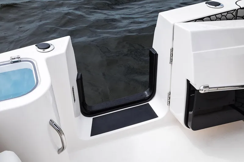 Slide: The Image of 2019 Wellcraft 262 Fisherman boat with open transom door and water view. - 65