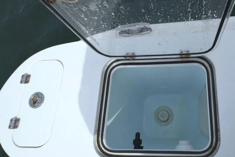 Slide: The Image of Open hatch on 2022 Sea Fox 248 Commander boat, showing storage compartment. - 13