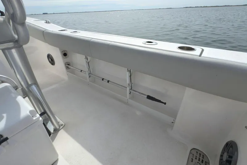 Slide: The Image of 2022 Sea Fox 248 Commander boat interior with rod holders and ocean view. - 18