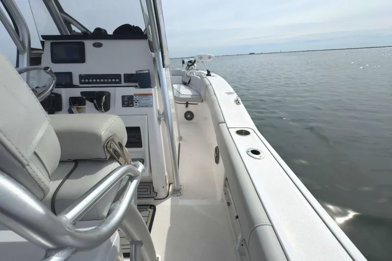 Slide: The Image of 2022 Sea Fox 248 Commander boat interior with steering console on calm water. - 20