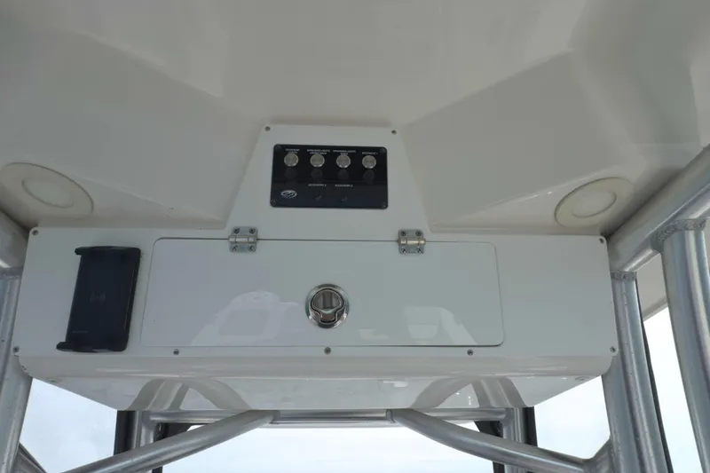 Slide: The Image of 2022 Sea Fox 248 Commander boat console with control panel and storage compartment. - 22