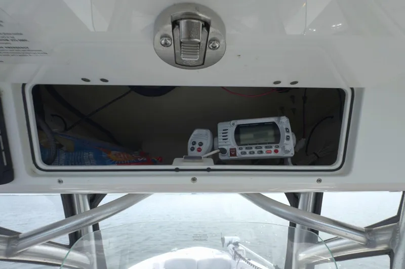 Slide: The Image of 2022 Sea Fox 248 Commander boat console with radio equipment and storage compartment. - 23
