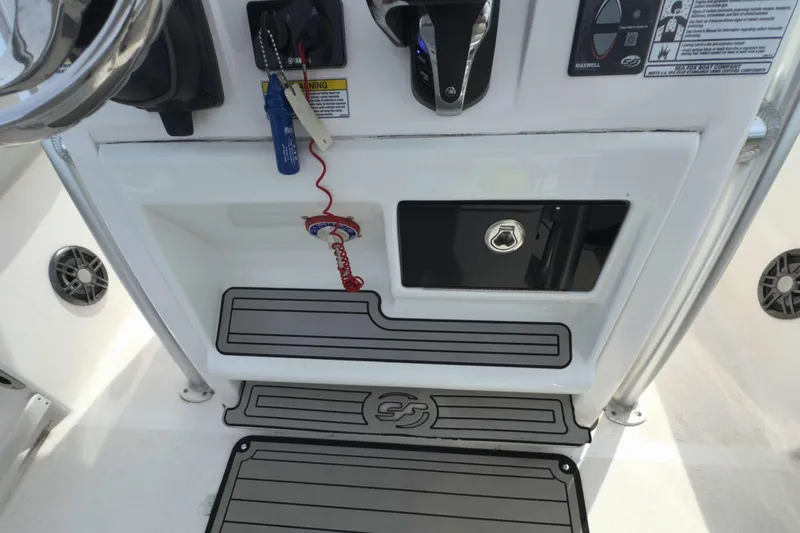 Slide: The Image of 2022 Sea Fox 248 Commander console with controls, storage, and safety features. - 24