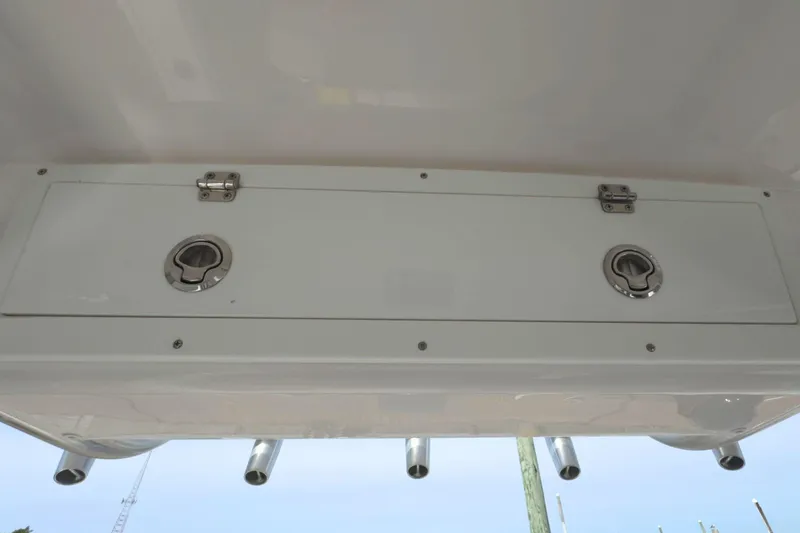 Slide: The Image of Storage compartment on 2022 Sea Fox 248 Commander boat, featuring secure latches and rod holders. - 26
