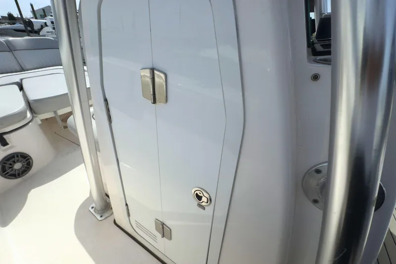 Slide: The Image of 2022 Sea Fox 248 Commander boat interior with storage compartment and seating area. - 27
