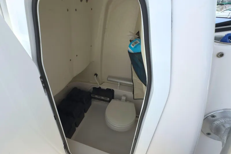 Slide: The Image of 2022 Sea Fox 248 Commander boat interior with toilet and storage area. - 28