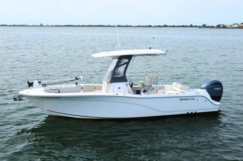 Slide: The Image of 2022 Sea Fox 248 Commander boat on calm water, featuring Yamaha engine. - 3