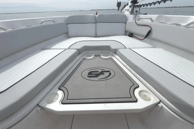Slide: The Image of 2022 Sea Fox 248 Commander boat interior with cushioned seating and logo. - 30