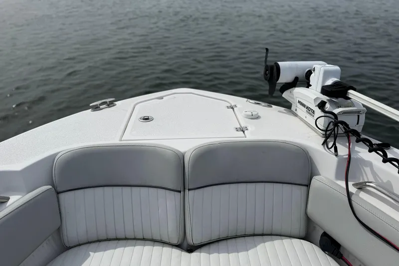 Slide: The Image of 2022 Sea Fox 248 Commander boat with Minn Kota trolling motor on calm water. - 34