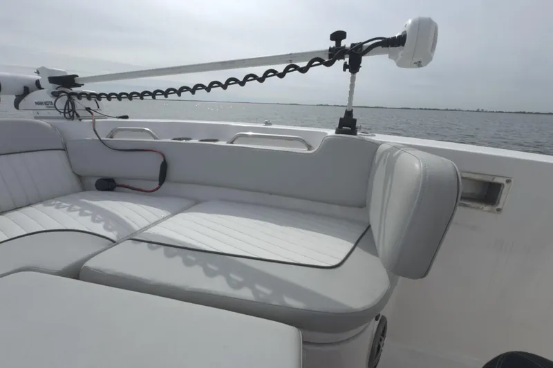 Slide: The Image of 2022 Sea Fox 248 Commander boat interior with cushioned seating and fishing equipment. - 35