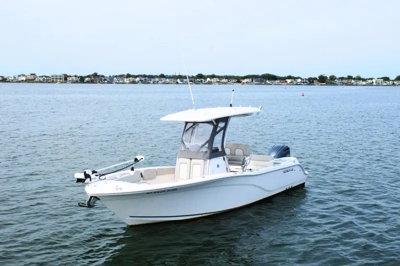 Slide: The Image of 2022 Sea Fox 248 Commander boat on calm water with distant shoreline. - 4