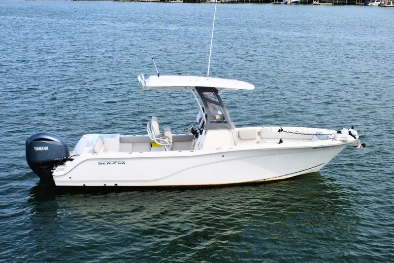 Slide: The Image of 2022 Sea Fox 248 Commander boat on calm water, featuring Yamaha outboard motor. - 5