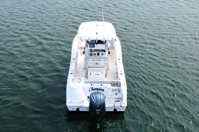 Slide: The Image of 2022 Sea Fox 248 Commander boat on water, rear view with outboard motor. - 7
