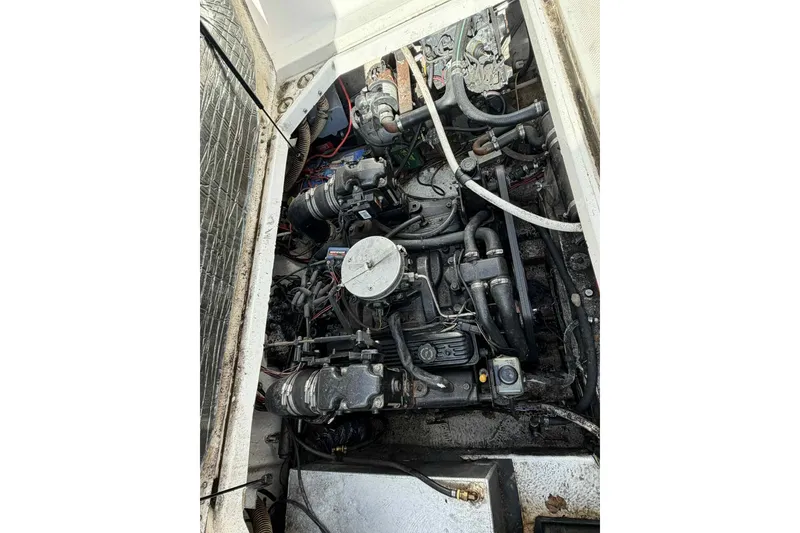 Slide: The Image of Engine compartment of a 1999 Bayliner 2655 Ciera boat, showing mechanical components. - 6