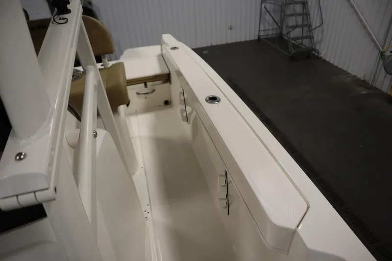 Slide: The Image of 2024 Bayliner Trophy T22CC boat interior with seating and storage features. - 18