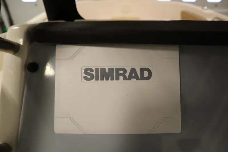 Slide: The Image of Simrad display on 2024 Bayliner Trophy T22CC boat dashboard. - 26