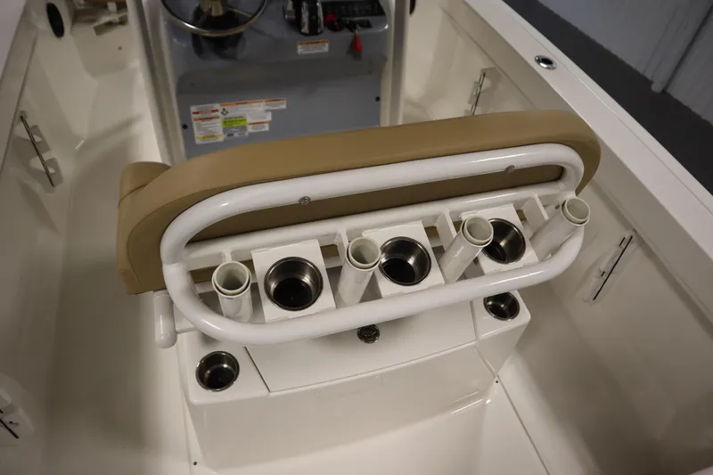 Slide: The Image of 2024 Bayliner Trophy T22CC boat console with rod holders and cup holders. - 30