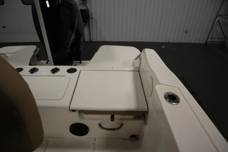 Slide: The Image of 2024 Bayliner Trophy T22CC boat interior with seating and storage features. - 34