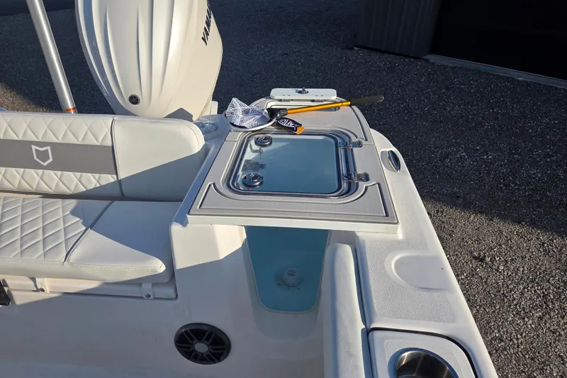Slide: The Image of 2026 Sea Fox 248 Commander boat interior with seating and storage compartment. - 11