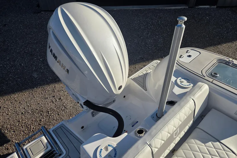 Slide: The Image of 2026 Sea Fox 248 Commander boat with Yamaha outboard motor, featuring sleek design and seating. - 12